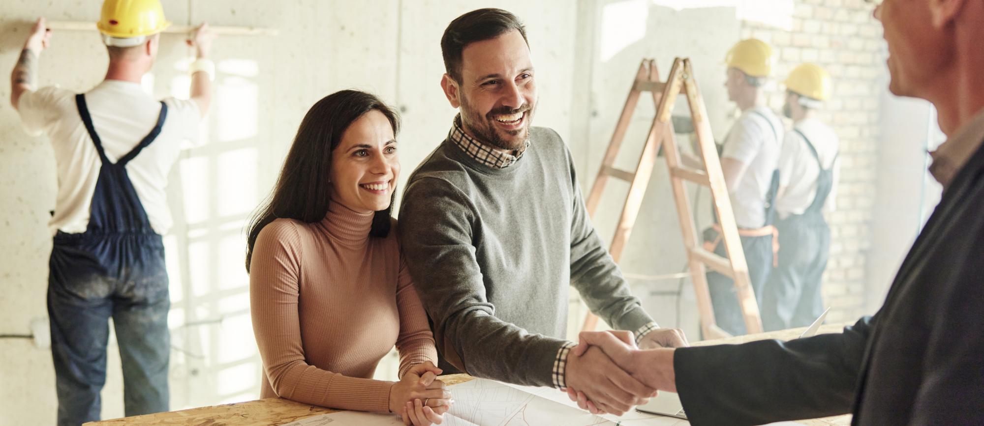 [A picture of couple working with a contractor]