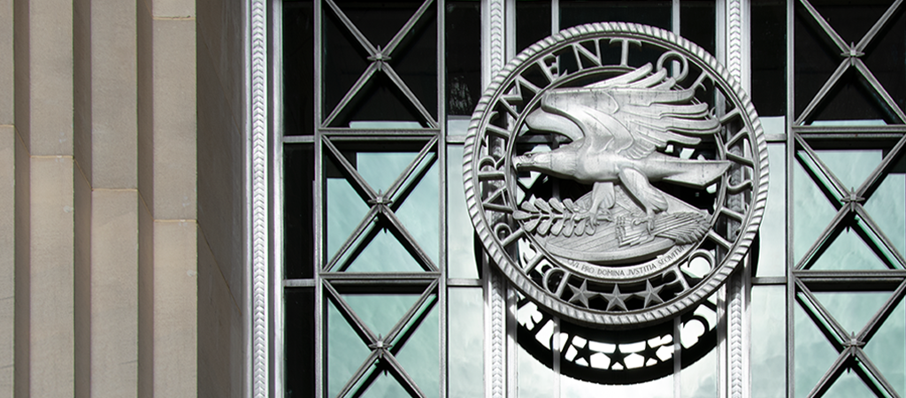 DOJ Seal on metal gate