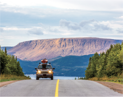 car on highway to gros morne national park