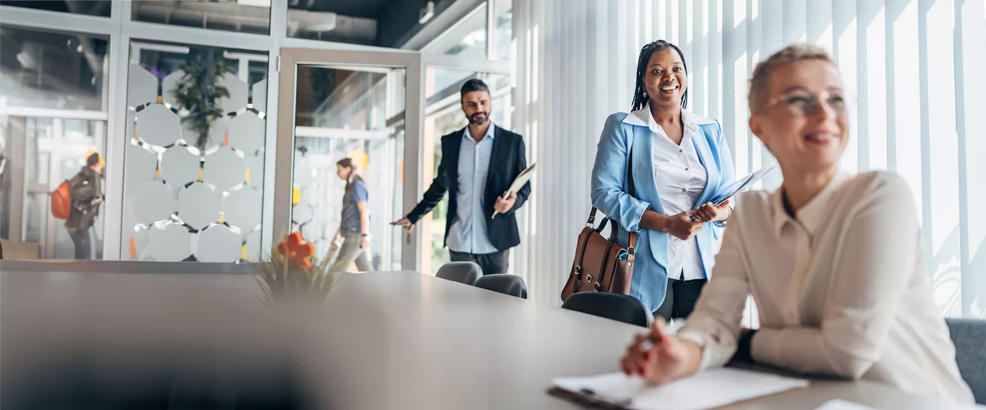 Group of business people entering a meeting room