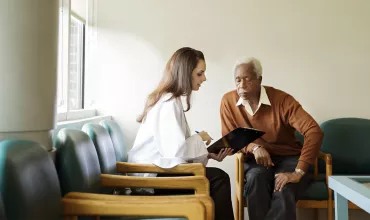 A doctor talks to a heart patient