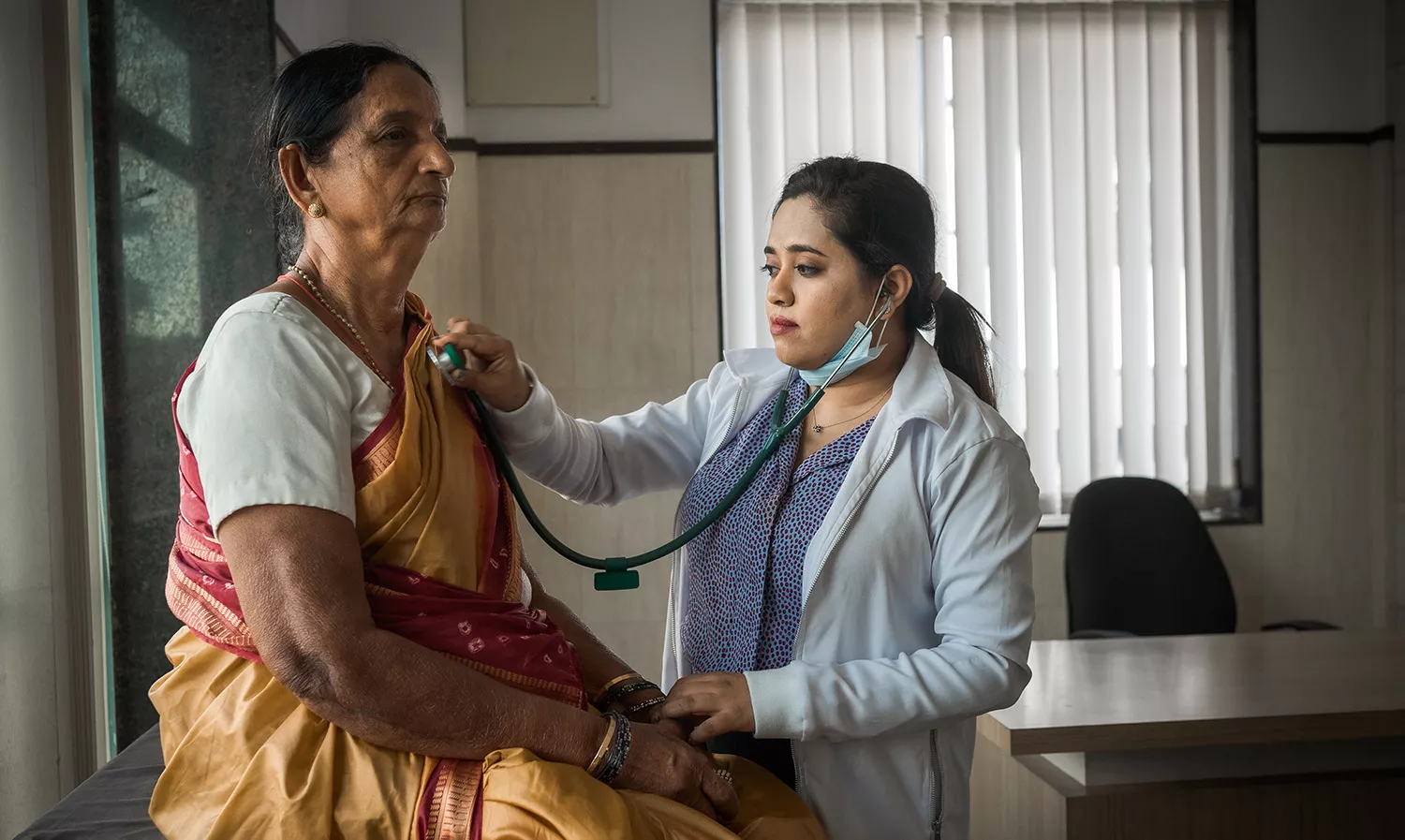 Elderly woman visits the doctor's clinic for a medical check-up