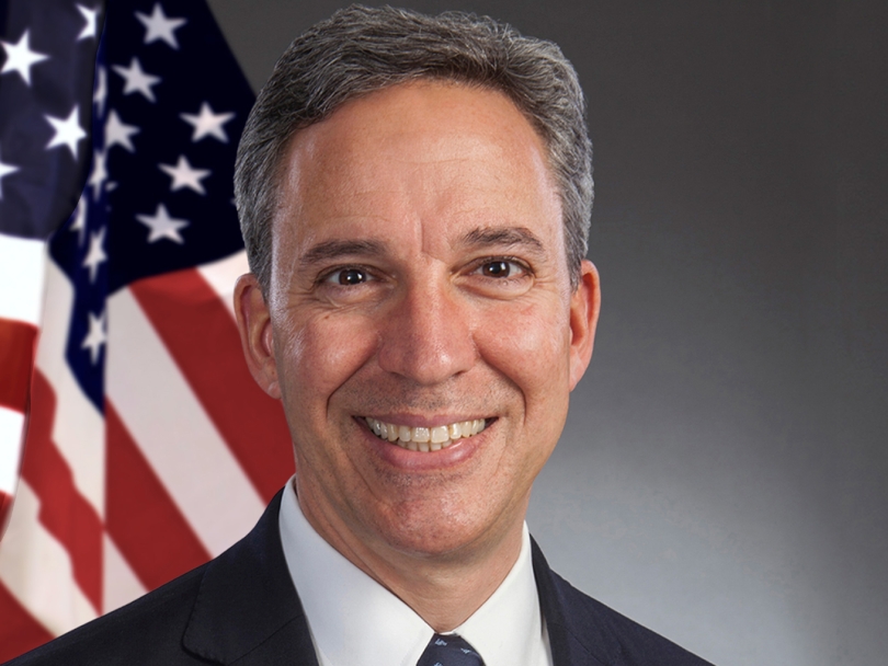 photo of Senator Jack M. Martins with a flag in the background 