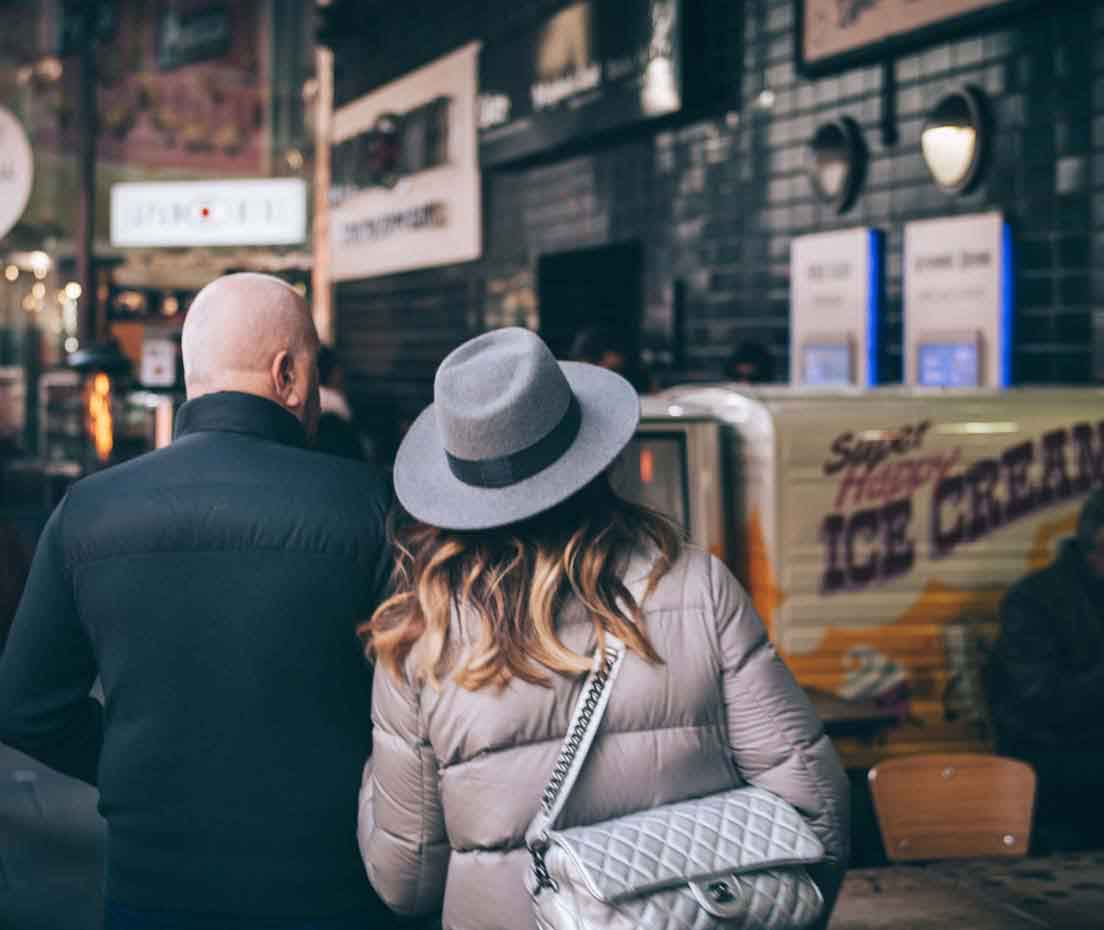 A couple walking down a street