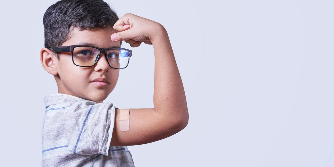 Vaccinated boy shows his arm