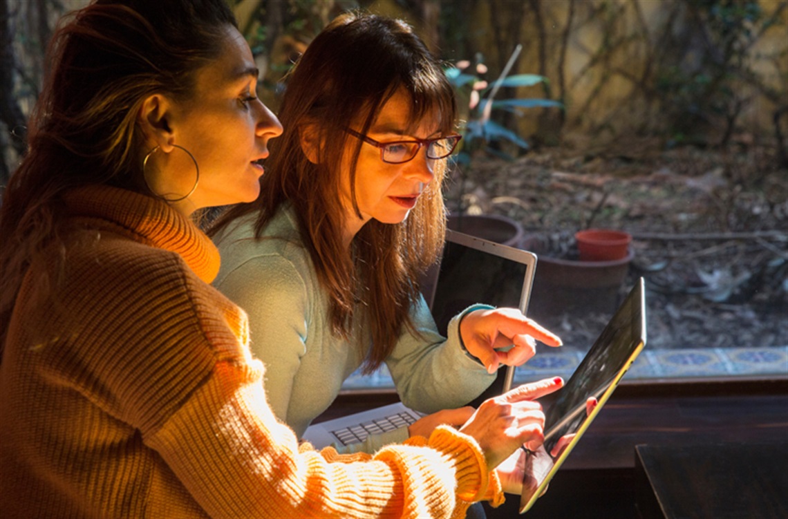 Mother and daughter searching the web