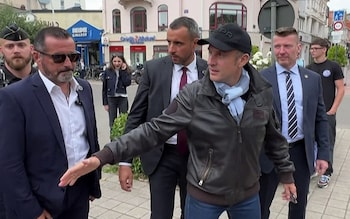 France's president Emmanuel Macron shaking hands with people in a street in Le Touquet-Paris-Plage