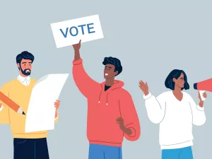 People holding posters and megaphones on election day