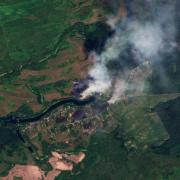 This satellite image released by Planet Labs PBC shows fires near the village of Krasnooktyabrskoe in Russia's Kursk region