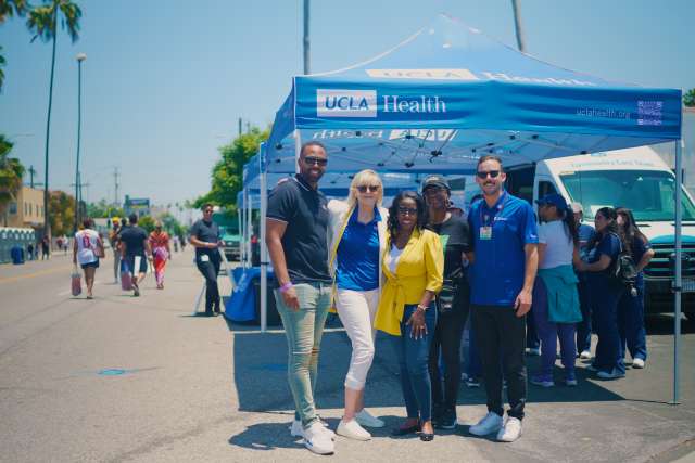 Mikel Whittier, from left, Becky Mancuso-Winding, Dr. Medell Briggs-Malonson, Shonda Peterson and Matthew Flesock were among those who represented UCLA Health at the New Orleans Corridor ribbon-cutting. (Photo by Milo Mitchell)