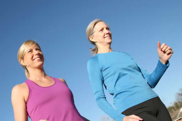 two women running