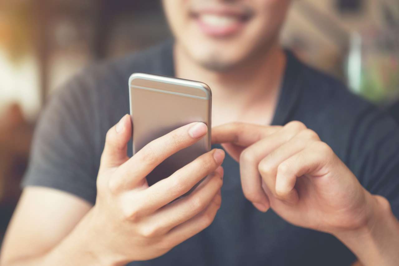 Man engaging with his mobile phone