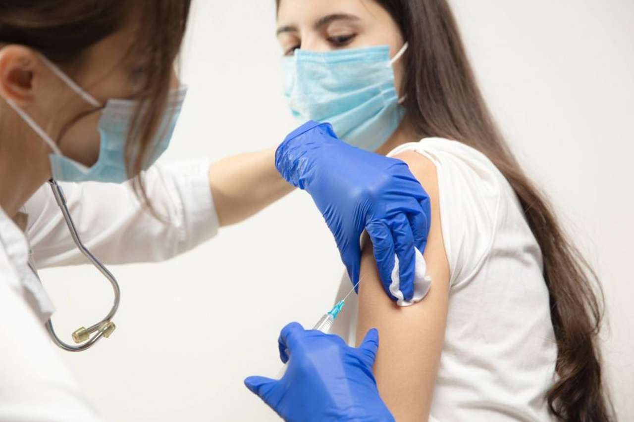 Teen getting vaccinated.