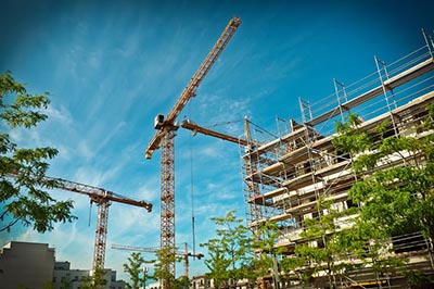 Large cranes working on a building construction