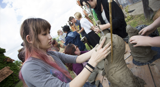 Female student making pottery during study abroad opportunity