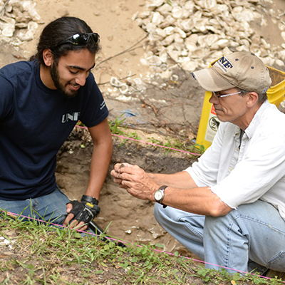 Student and professor at archaeology