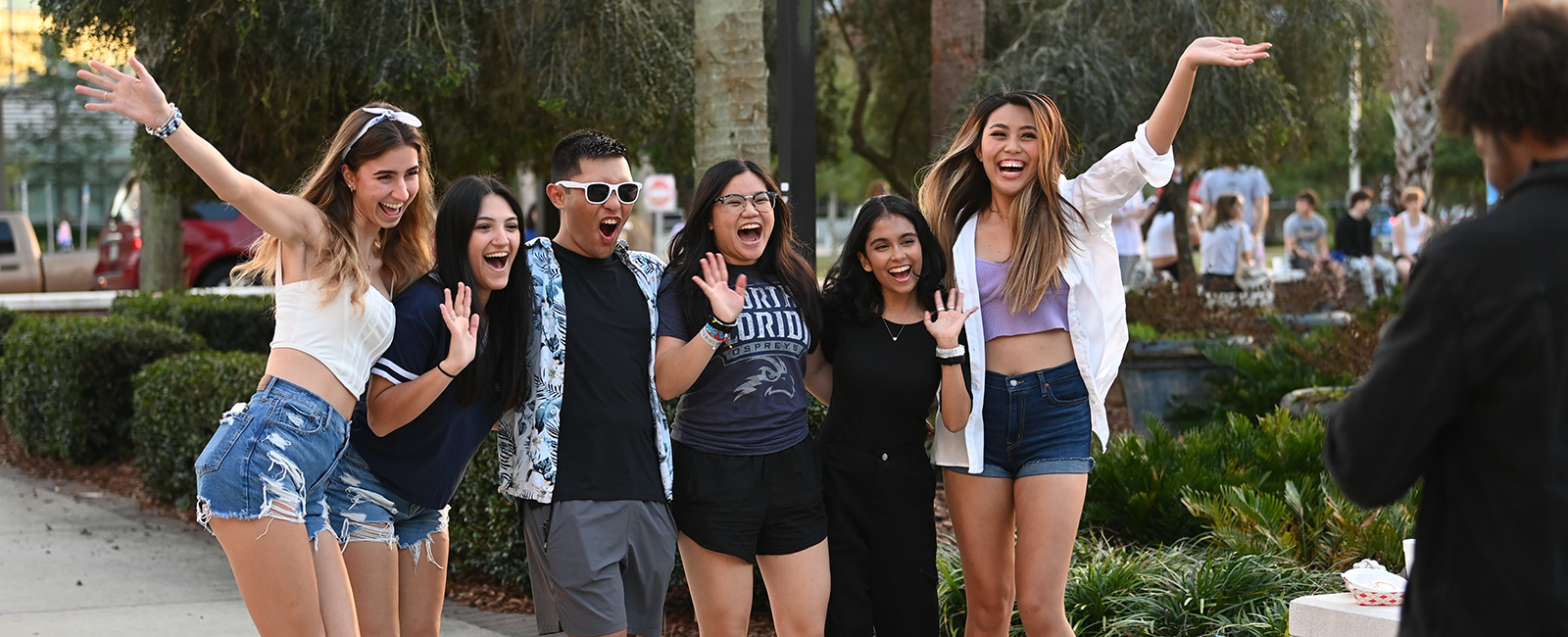 UNF students smiling and having fun while posing for a picture, you can really see the happiness on their faces