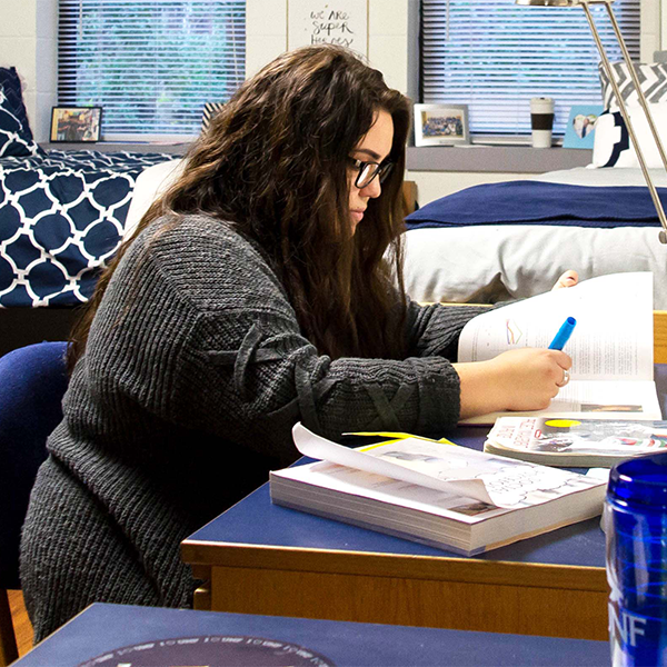 resident studying in room