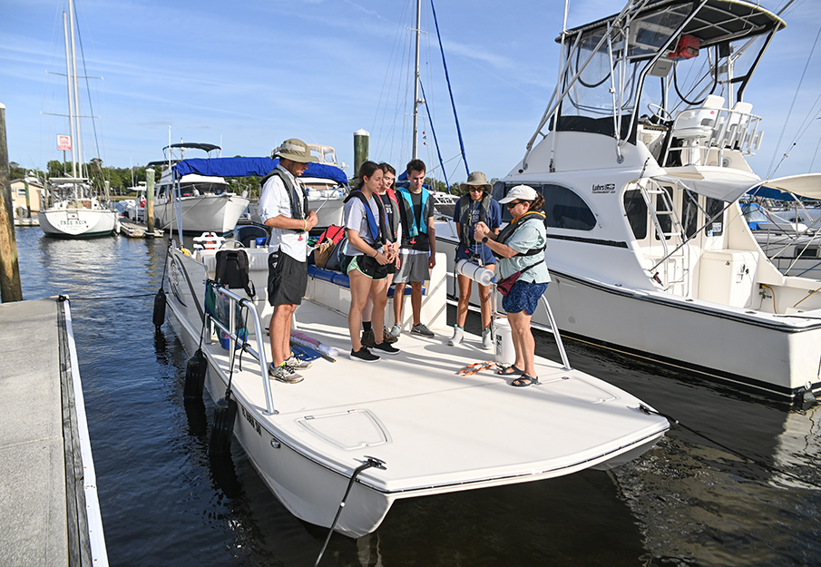 Marine biology students getting ready for an excursion on the UNF research boat