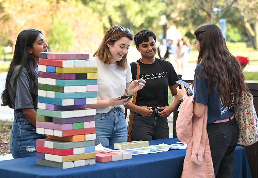 Pumpkin Spice Table Talking to Student