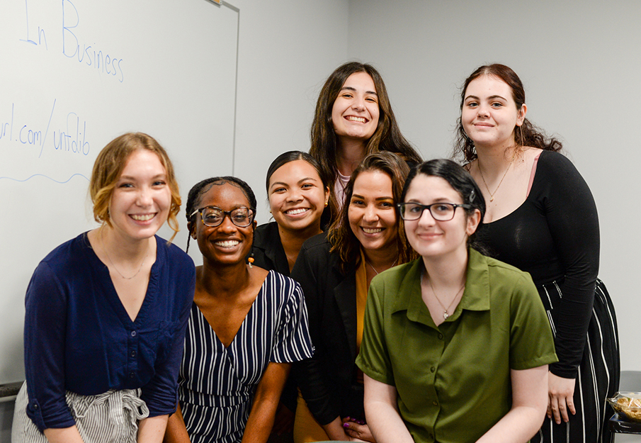 A group of women students posing for a photo at a Coggin event