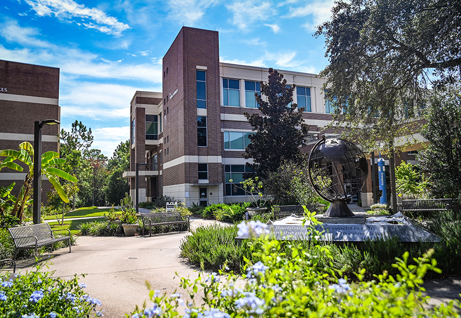 Globe statue in front of Coggin building