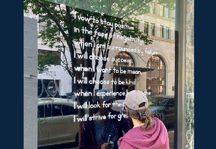 Lady writing poetry on a window