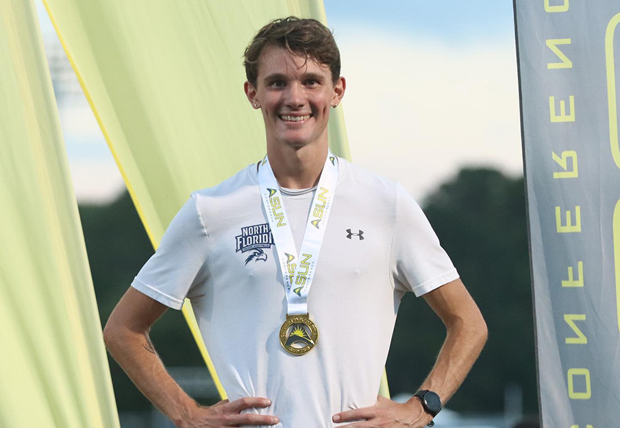 Aidan O'Gorman standing with ASUN metal around his neck