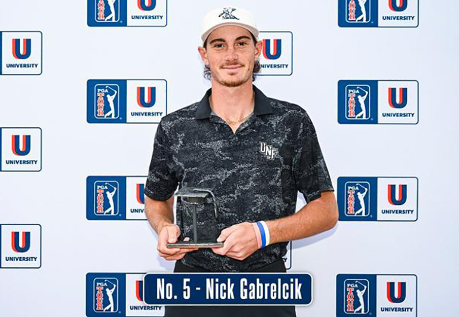 Nick Gabrelcik posing with PGA award