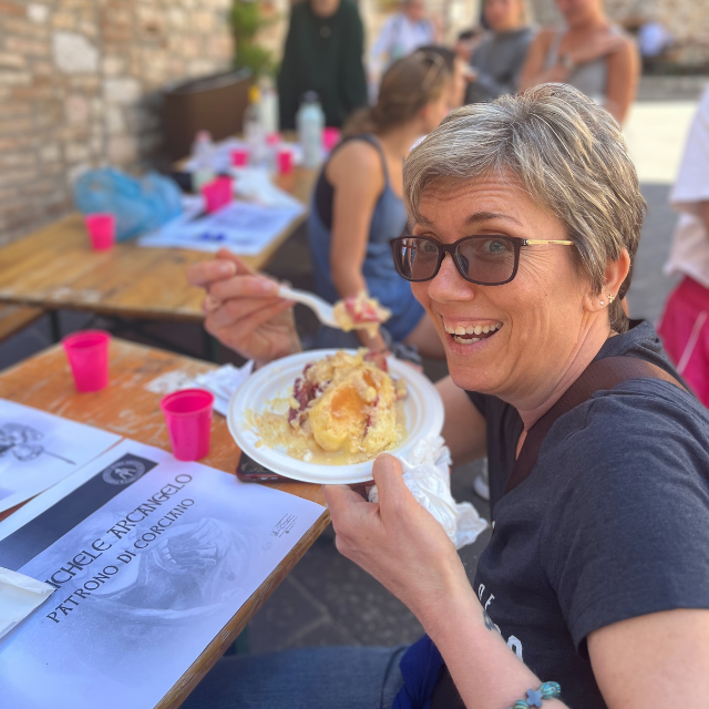 Faculty in Italy eating dessert