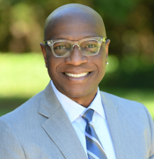 A smiling headshot of Vice President Richmond Wynn