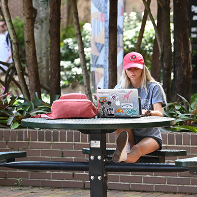 A student sitting at a table studying