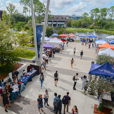 students walking around market day