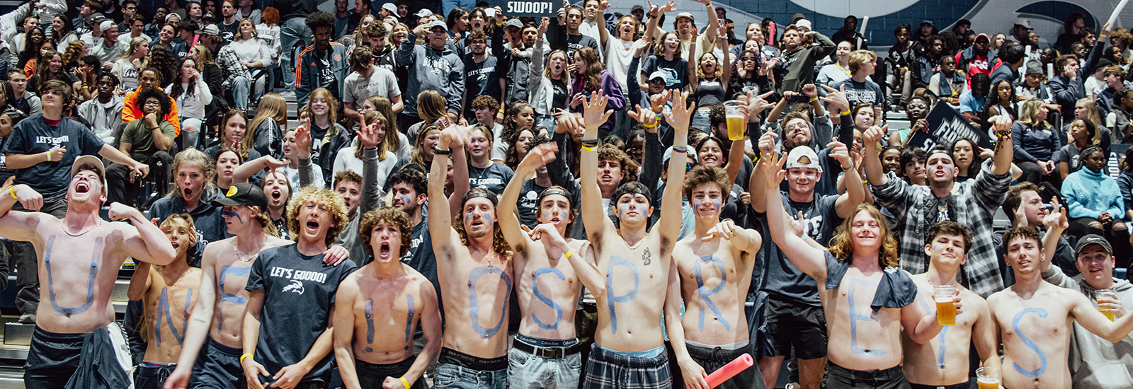 UNF Osprey fans at a game cheering