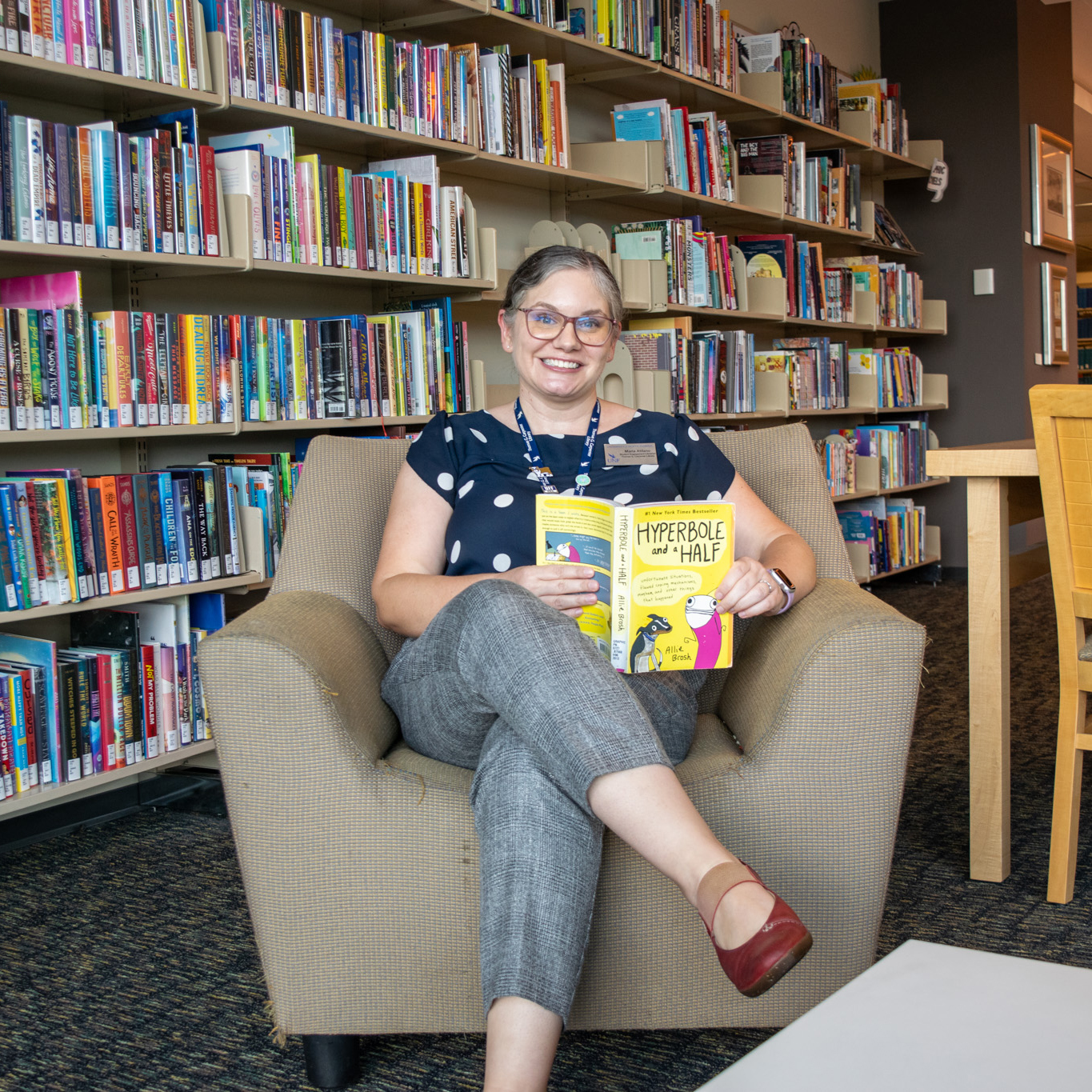 Maria Atilano sitting in library