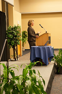 stage left view of a speaker at a podium