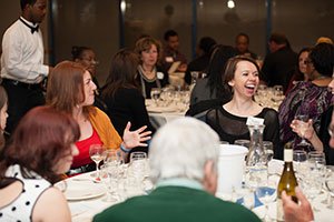 happy people at a dinner table