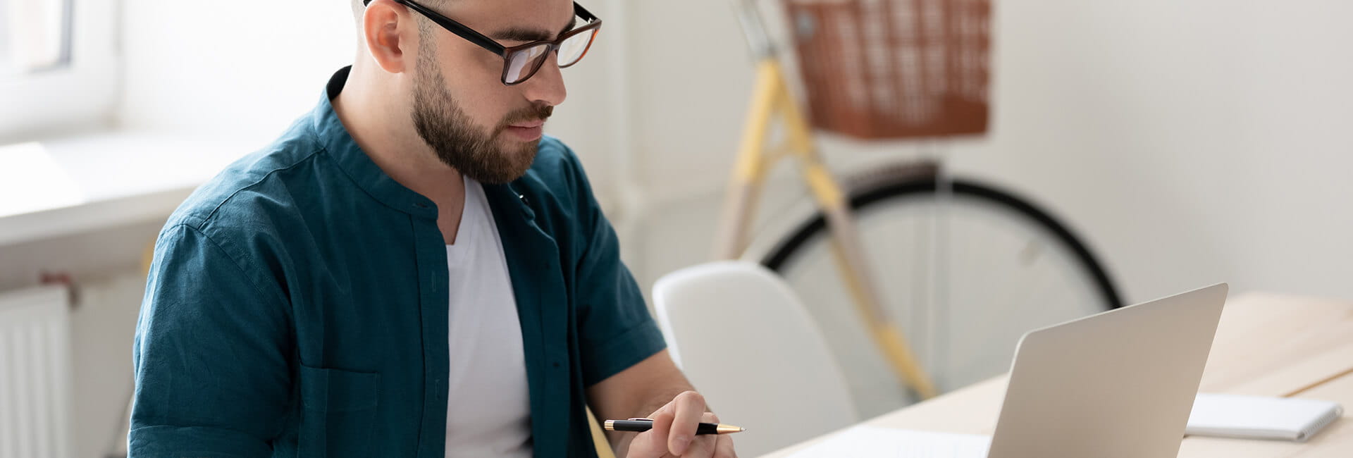 Man studying at a table at home