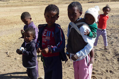 Children in a desert landscape