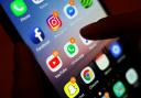 The Australian government has promised to legislate this year to enforce a minimum age for children to access social media (Yui Mok/PA)