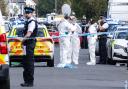 Police scenes-of-crime officers (SOCOs) at the scene in Southport