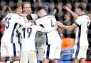 Harry Kane, second left, celebrates his second goal against Finland with team-mates (Nick Potts/PA)