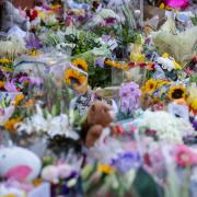 Floral tributes on the junction of Tithebarn Road and Hart Street in Southport, near the scene where three children were fatally stabbed at a Taylor Swift-themed holiday club