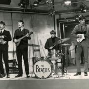 1.	This is a photo of John Lennon, Paul McCartney, George Harrison and Ringo Starr performing in the UK in the 1960s. See PA Feature TRAVEL Beatles. WARNING: This picture must only be used to accompany PA feature TRAVEL Beatles. PA Photo. Picture credit