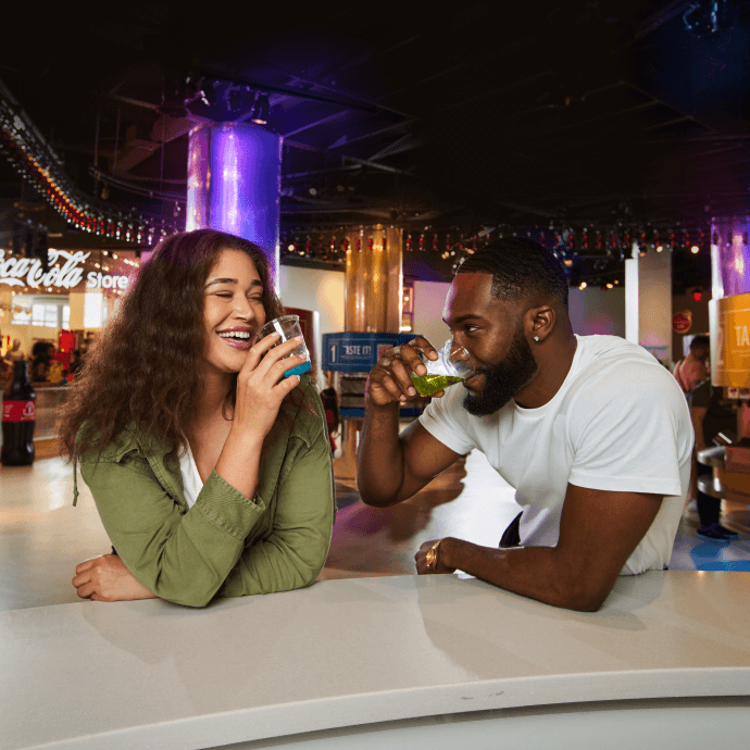 two people sharing a drink