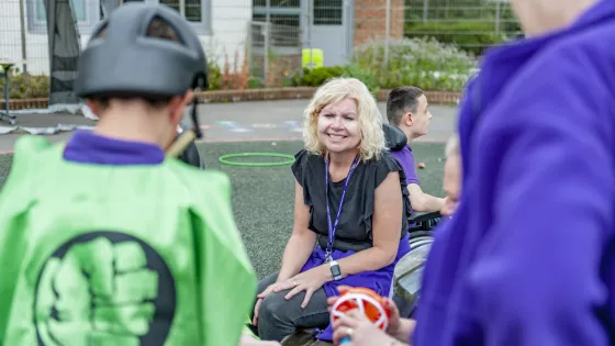 teacher smiling at a school party