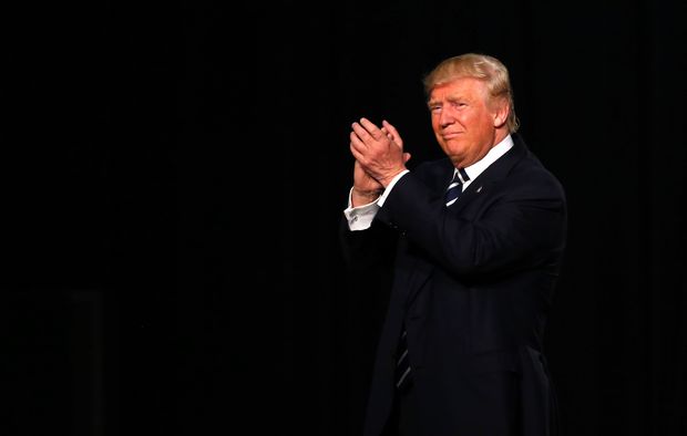 US Republican presidential candidate Donald Trump exits his final rally of the GOP 2016 presidential campaign at Devos Place in Grand Rapids, Michigan on November 7, 2016.