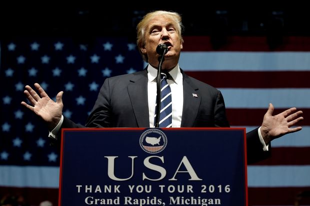  U.S. President-elect Donald Trump speaks at a "Thank You USA" tour rally in Grand Rapids, Michigan, U.S. December 9, 2016. REUTERS/Mike Segar/File photo ORG XMIT: SIN91