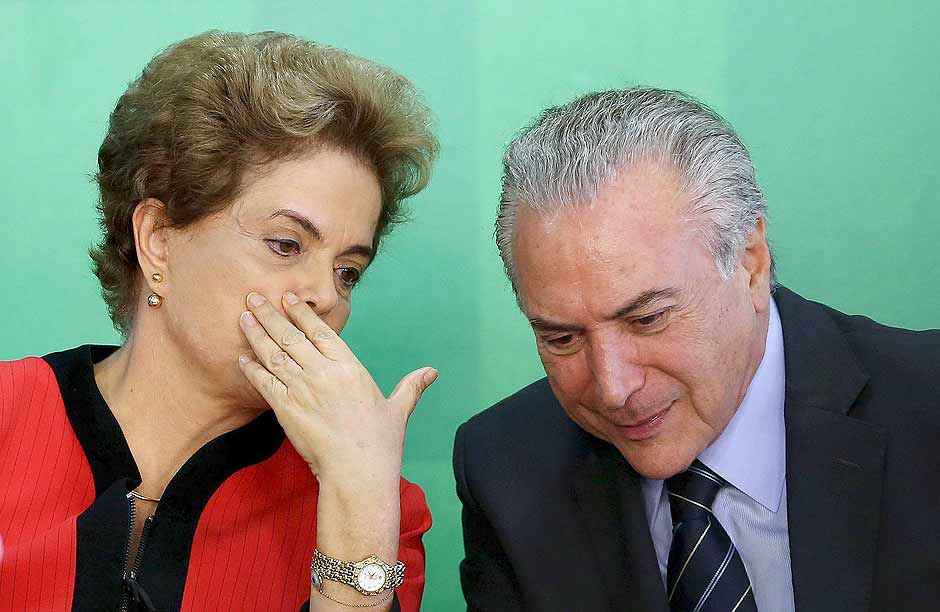 Brazil's President Dilma Rousseff (L) talks to Vice President Michel Temer at the Planalto Palace in Brasilia, Brazil, in this March 2, 2016 file photo. Brazil's President Dilma Rousseff scrambled on March 30, 2016, to hold together her crumbling ruling coalition by negotiating key government posts with remaining allies, aides said, as key partners discussed abandoning her amid impeachment proceedings. REUTERS/Adriano Machado/Files ORG XMIT: TOR611