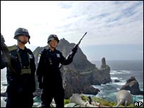 South Korean police officers stand guard on the Dokdo/Takeshima islands